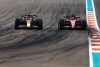 MIAMI, FLORIDA - MAY 08: Max Verstappen of the Netherlands driving the (1) Oracle Red Bull Racing RB18 overtakes Charles Leclerc of Monaco driving (16) the Ferrari F1-75 for the lead during the F1 Grand Prix of Miami at the Miami International Autodrome on May 08, 2022 in Miami, Florida. (Photo by Mark Thompson/Getty Images) // Getty Images / Red Bull Content Pool // SI202205082758 // Usage for editorial use only //